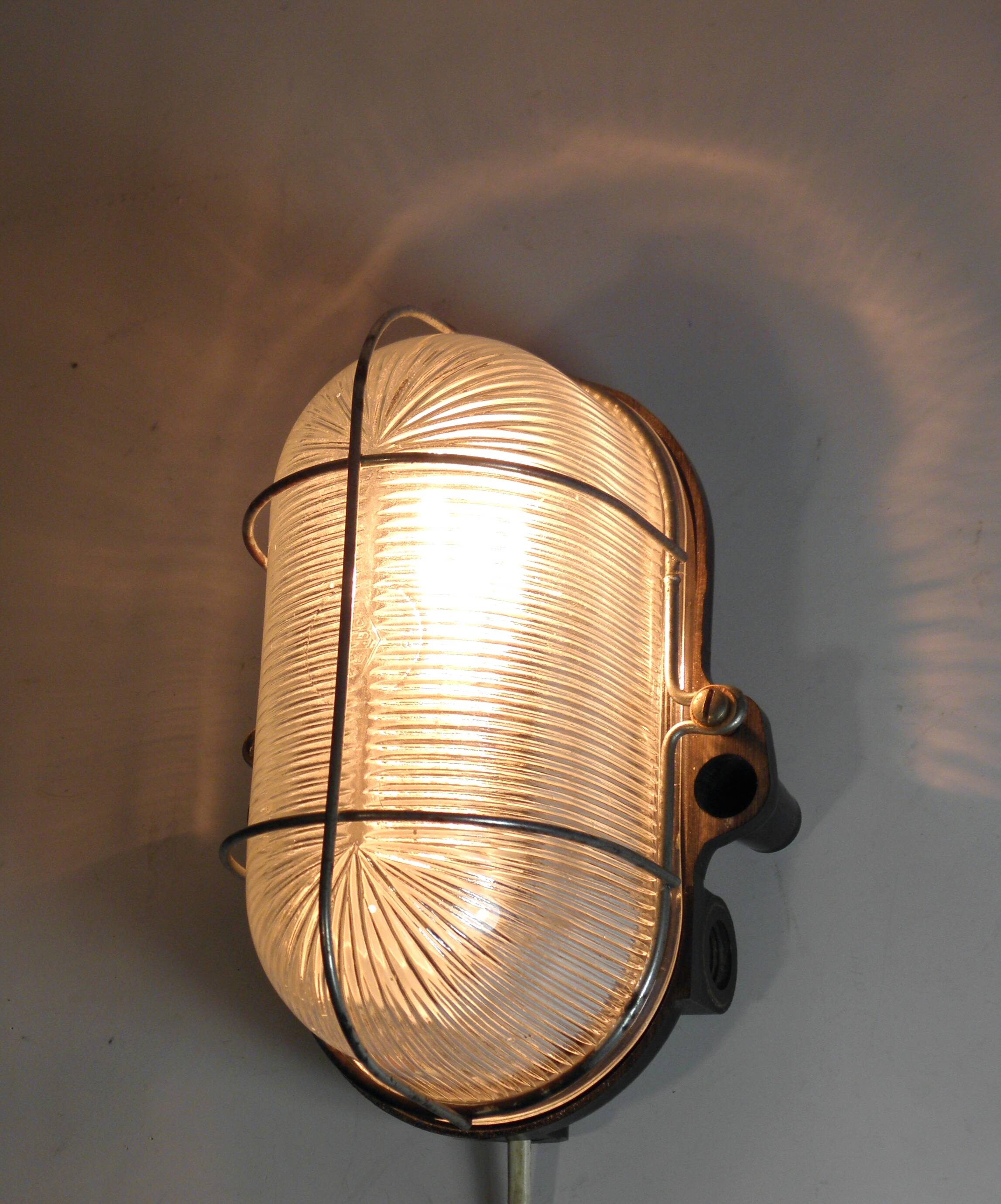 Glass and Bakelite wall light from the 1950s.