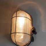 Glass and Bakelite wall light from the 1950s.