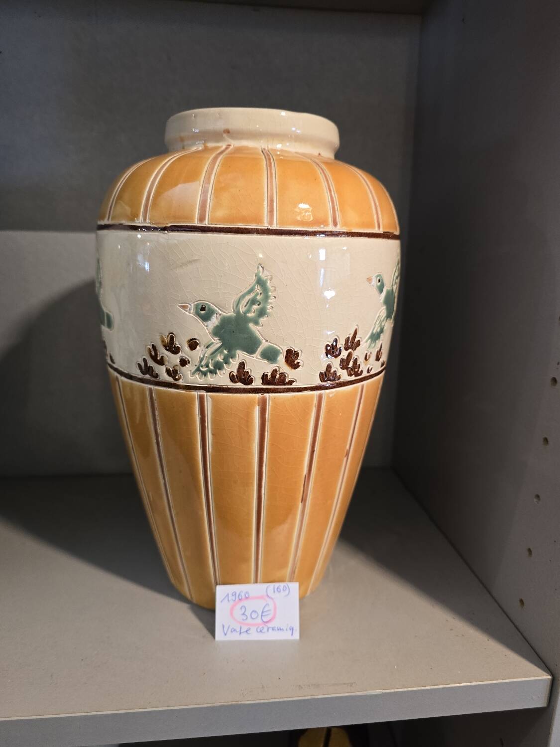 Orange and green ceramic vase with duck motif