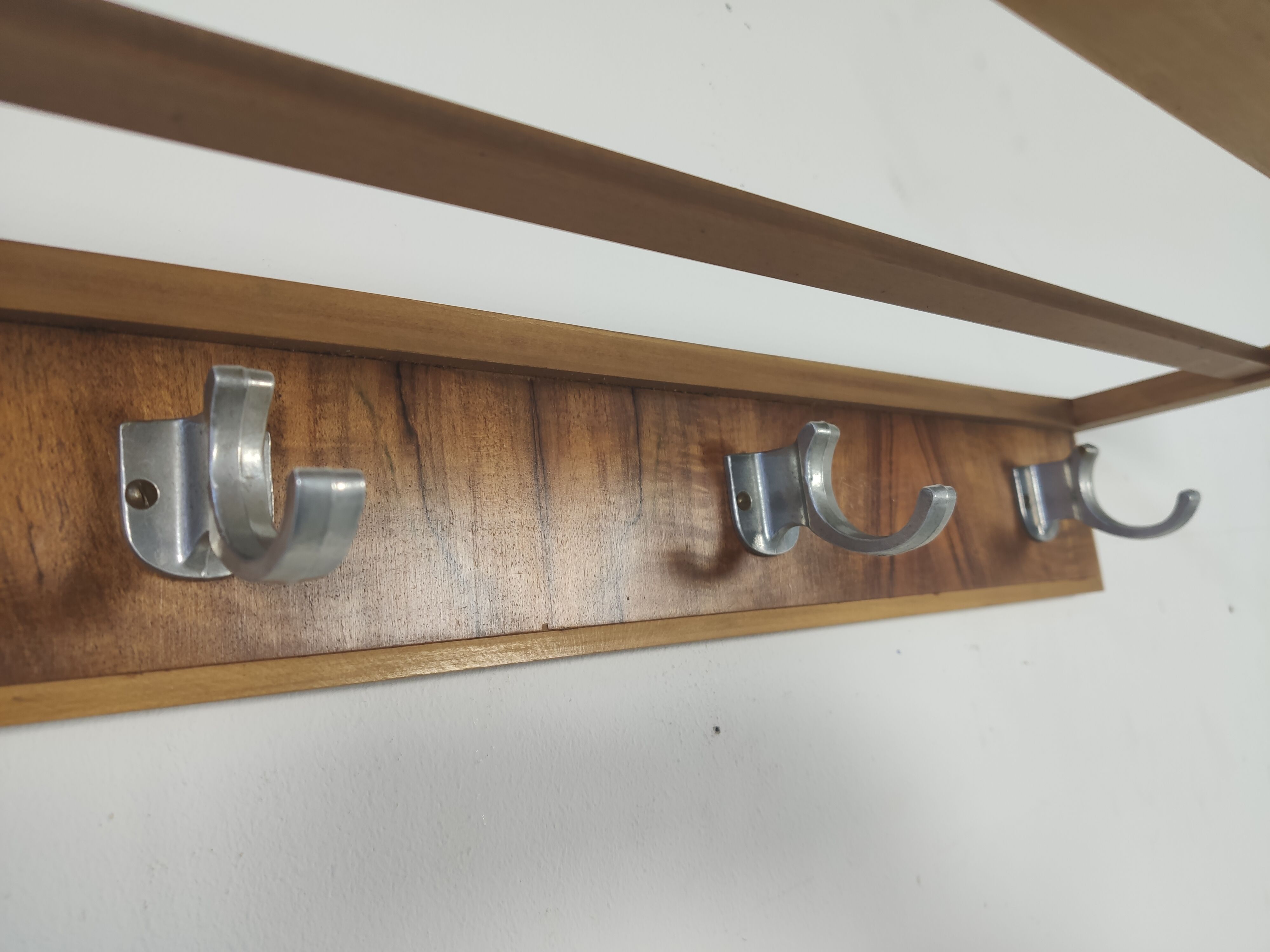 Walnut and metal wall coat rack, 1950s