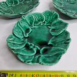 Set of three enamelled, emerald green, leaf-decorated faent cups