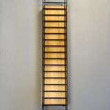 Floating wall shelf in oak veneer and black metal, 1960s.