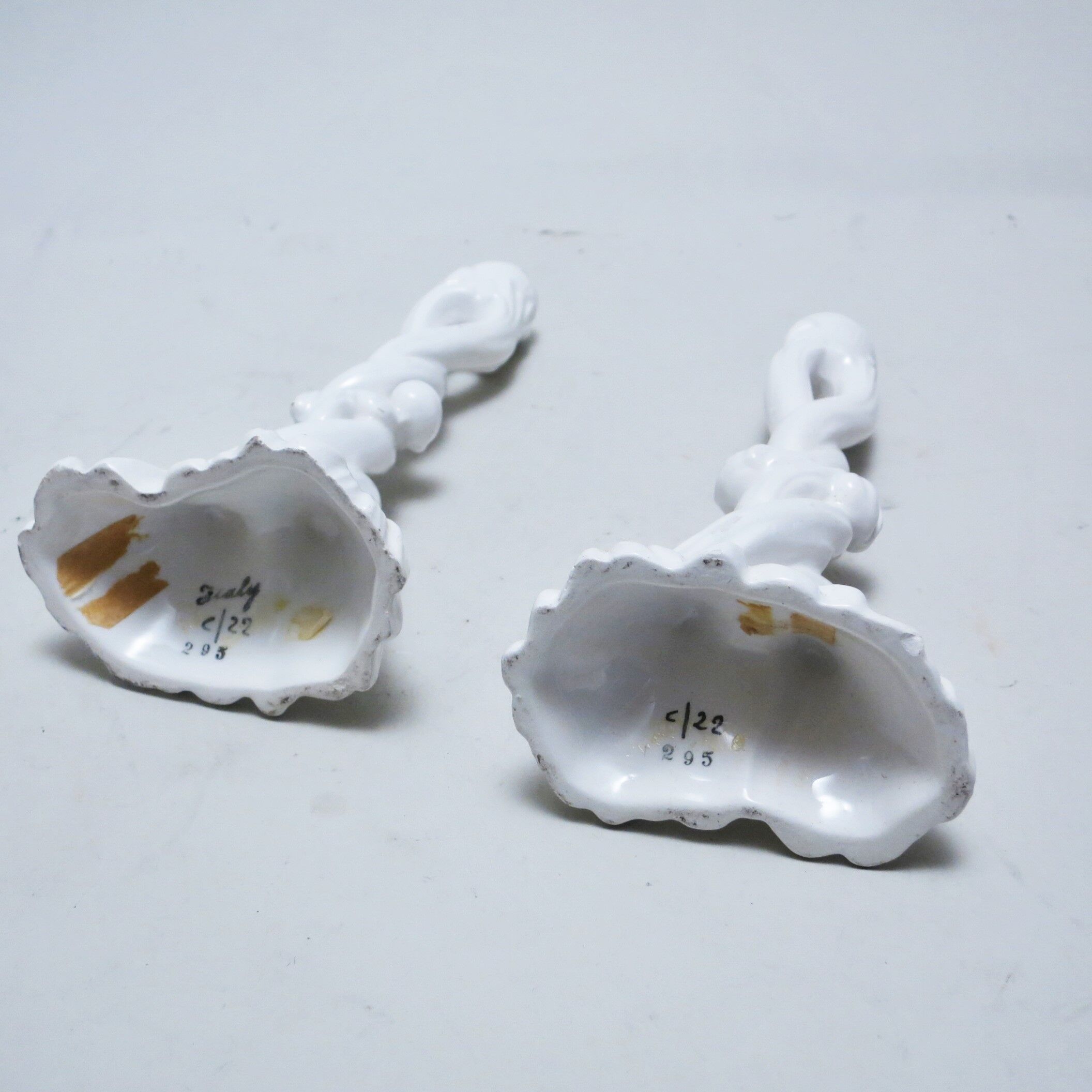 Pair of white ceramic candlesticks