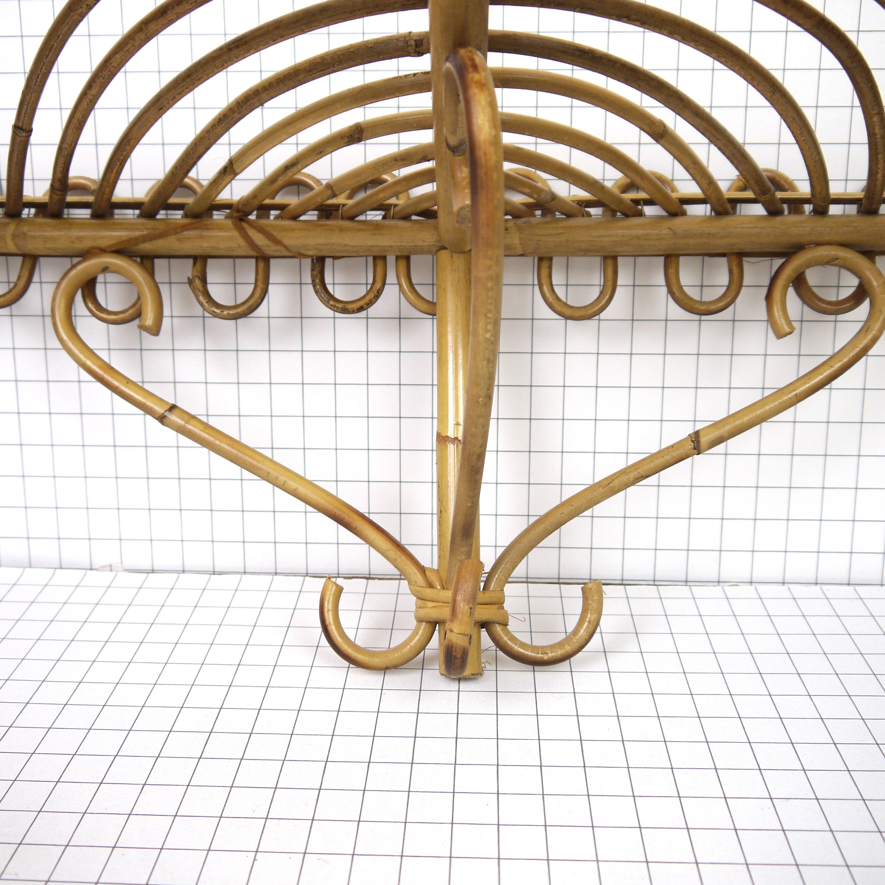 Half-moon rattan shelf and coat holder