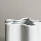 Modern white ceramic vase with wavy curves