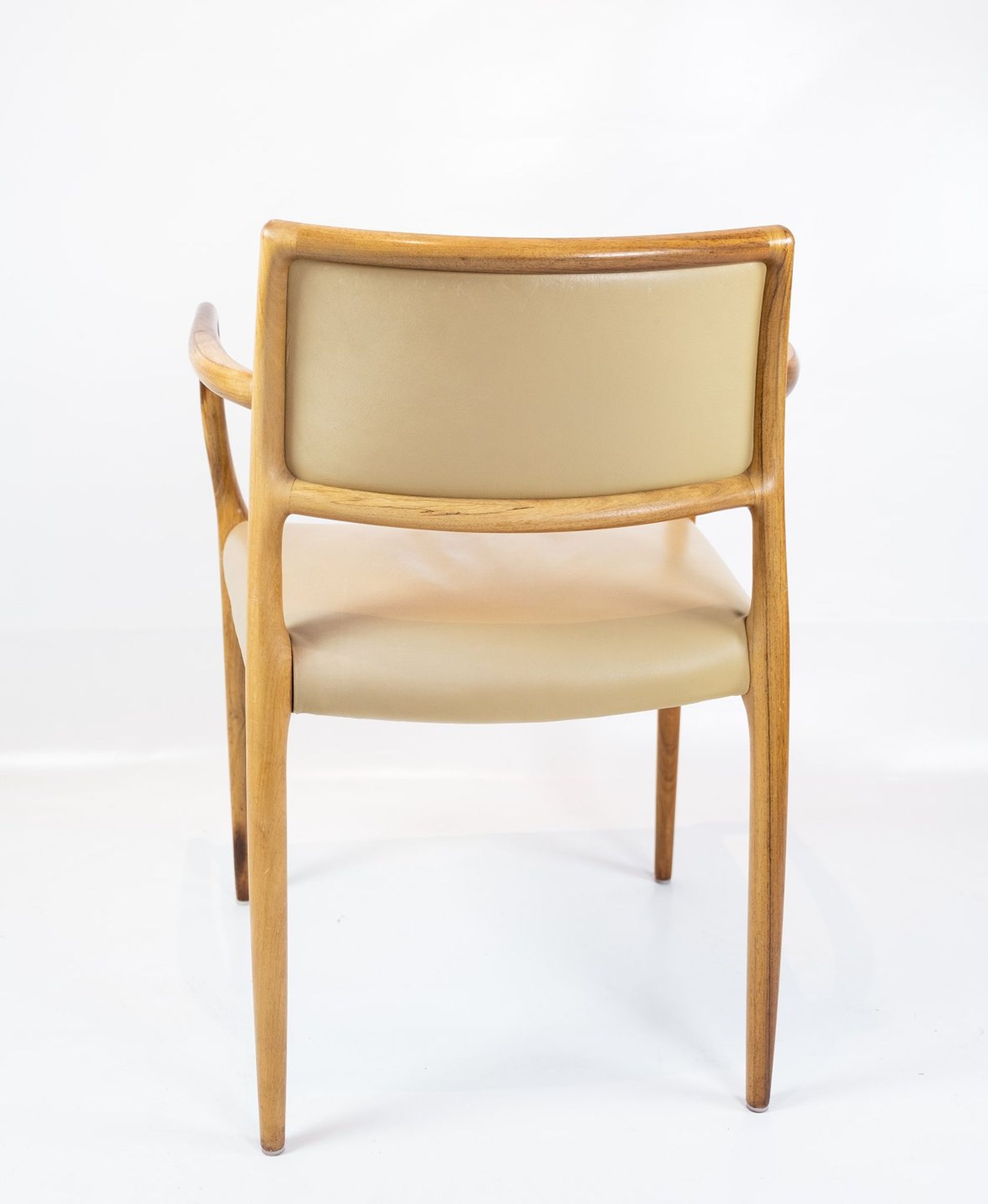 Pair of N.O. Moeller armchairs, model 65, in rosewood and light leather