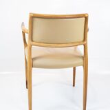 Pair of N.O. Moeller armchairs, model 65, in rosewood and light leather