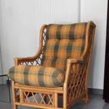 Vintage armchair in bamboo and rattan with a tartan pattern.