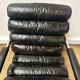 Vintage 1970s black leather armchair – metal frame