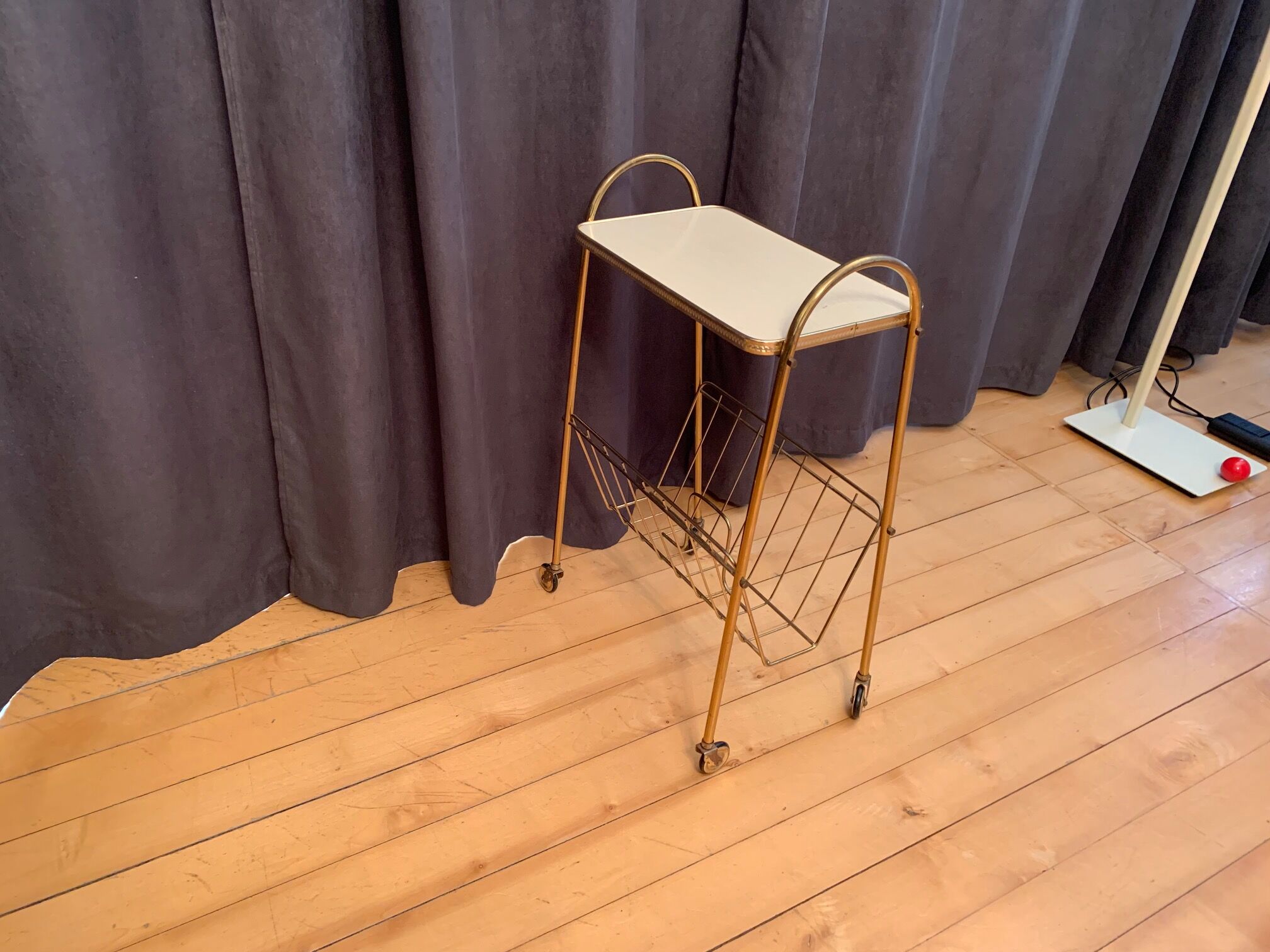 Mobile newspaper holder, 1960s