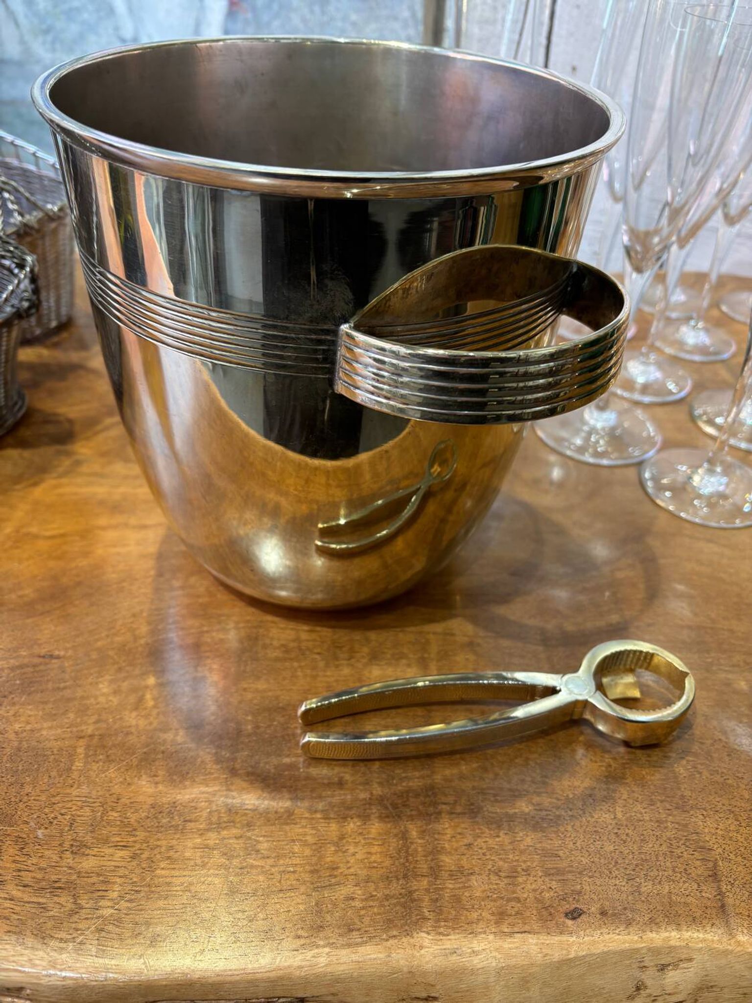 Alpaca champagne bucket from the 1920s with its monopole tongs.