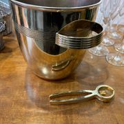 Alpaca champagne bucket from the 1920s with its monopole tongs.