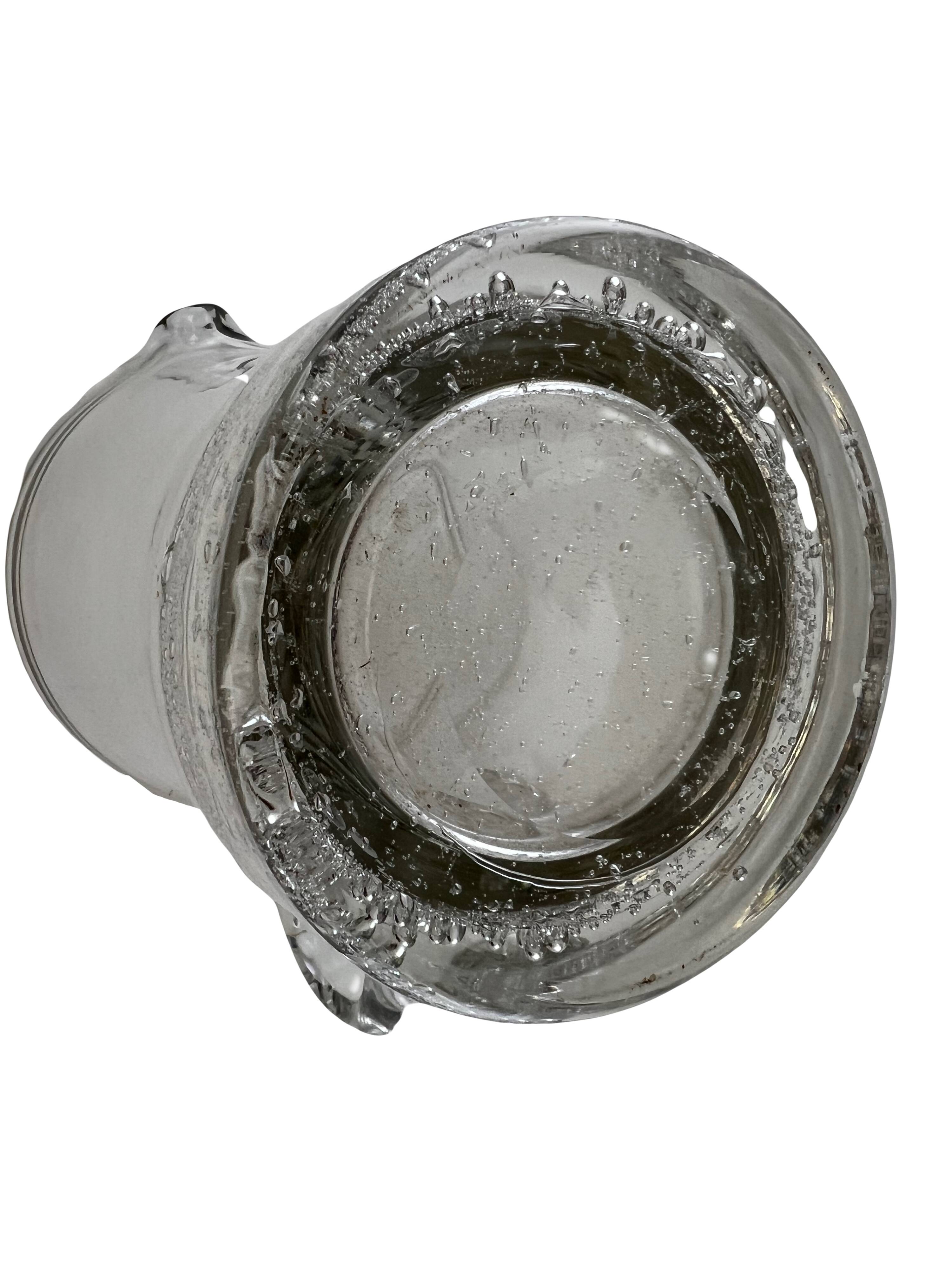 Large stylized glass pitcher