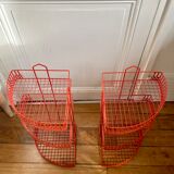 Red enamelled metal wall shelves