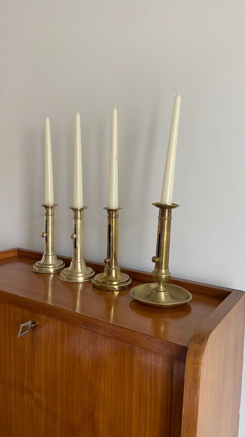 Pair of antique brass push candlesticks