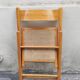 Wooden folding chair with caning from the 1980s.