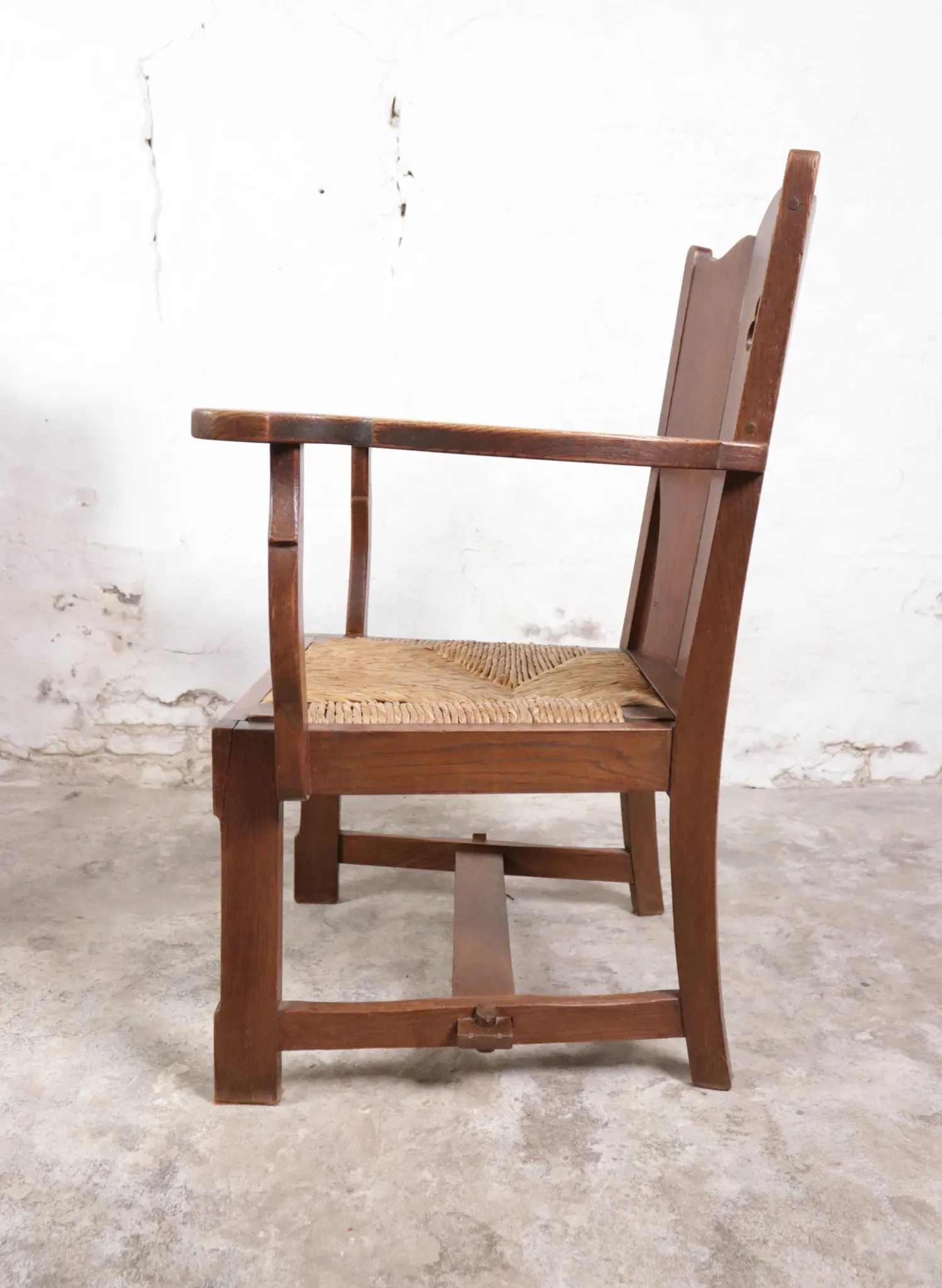 Pair of brutalist oak lounge chairs with rush seats – Netherlands