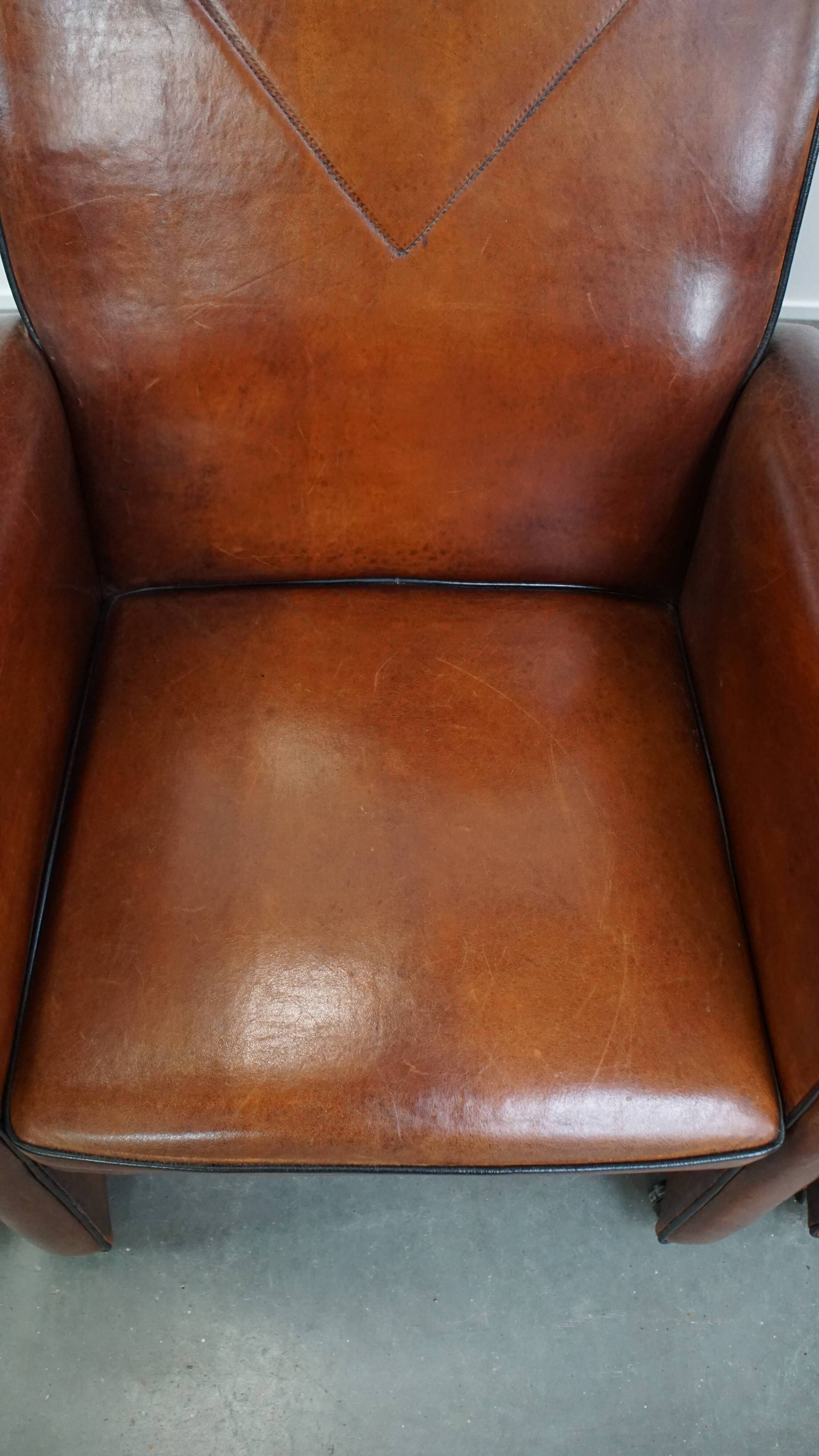 Vintage set of 4 sheepskin leather dining chairs on castors