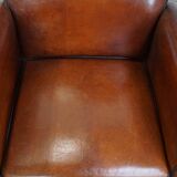 Vintage set of 4 sheepskin leather dining chairs on castors