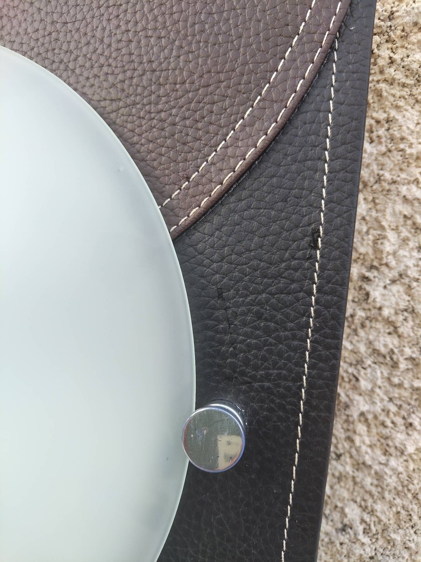 Wall light or ceiling light in frosted glass and leather-like material.