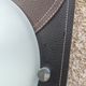 Wall light or ceiling light in frosted glass and leather-like material.