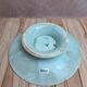 Old small compote dish in turquoise majolica with raised floral decoration.