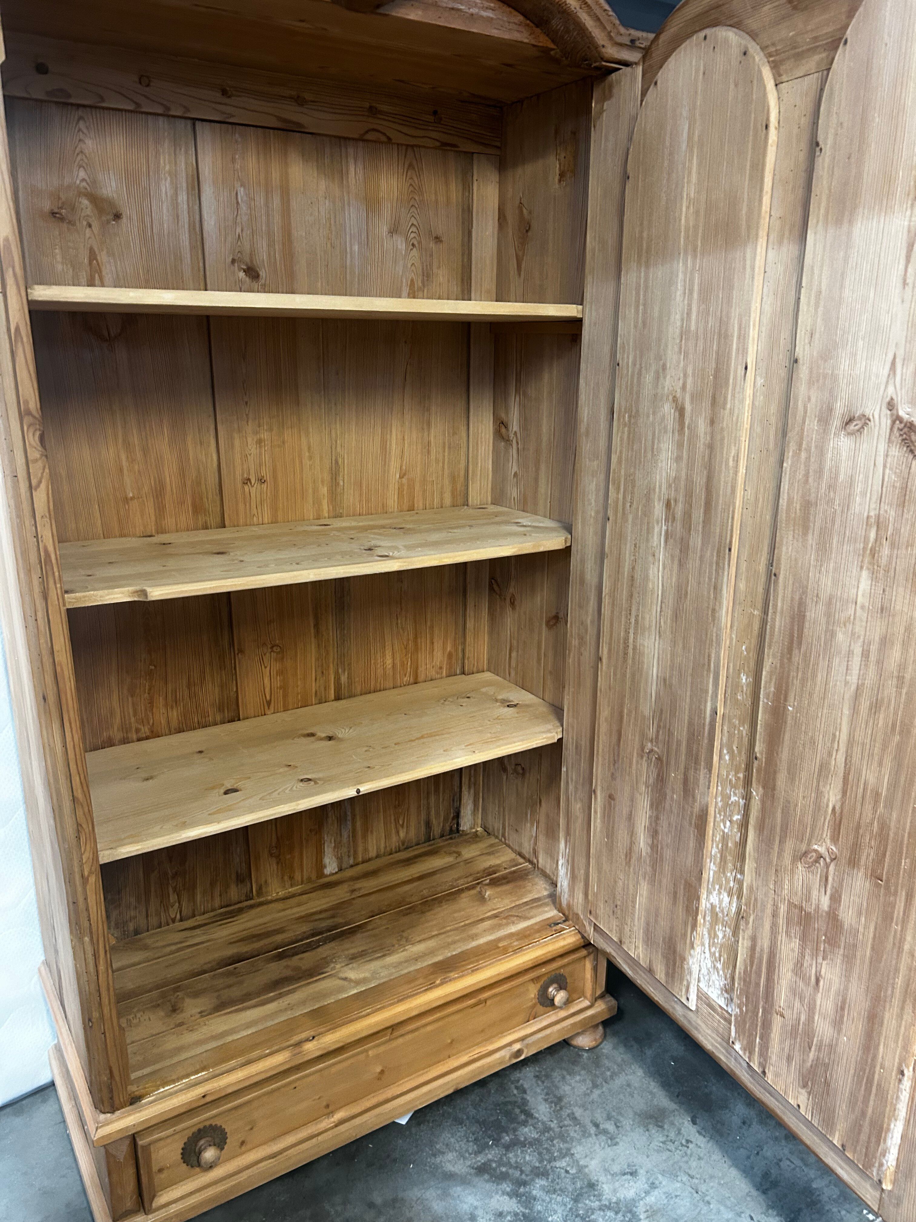 Large country pine bonnetière with carved details.