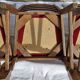 Round wooden table with 1 integrated extension + 6 wooden and fabric chairs