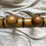 Antique wall-mounted coat rack in turned bamboo-style wood