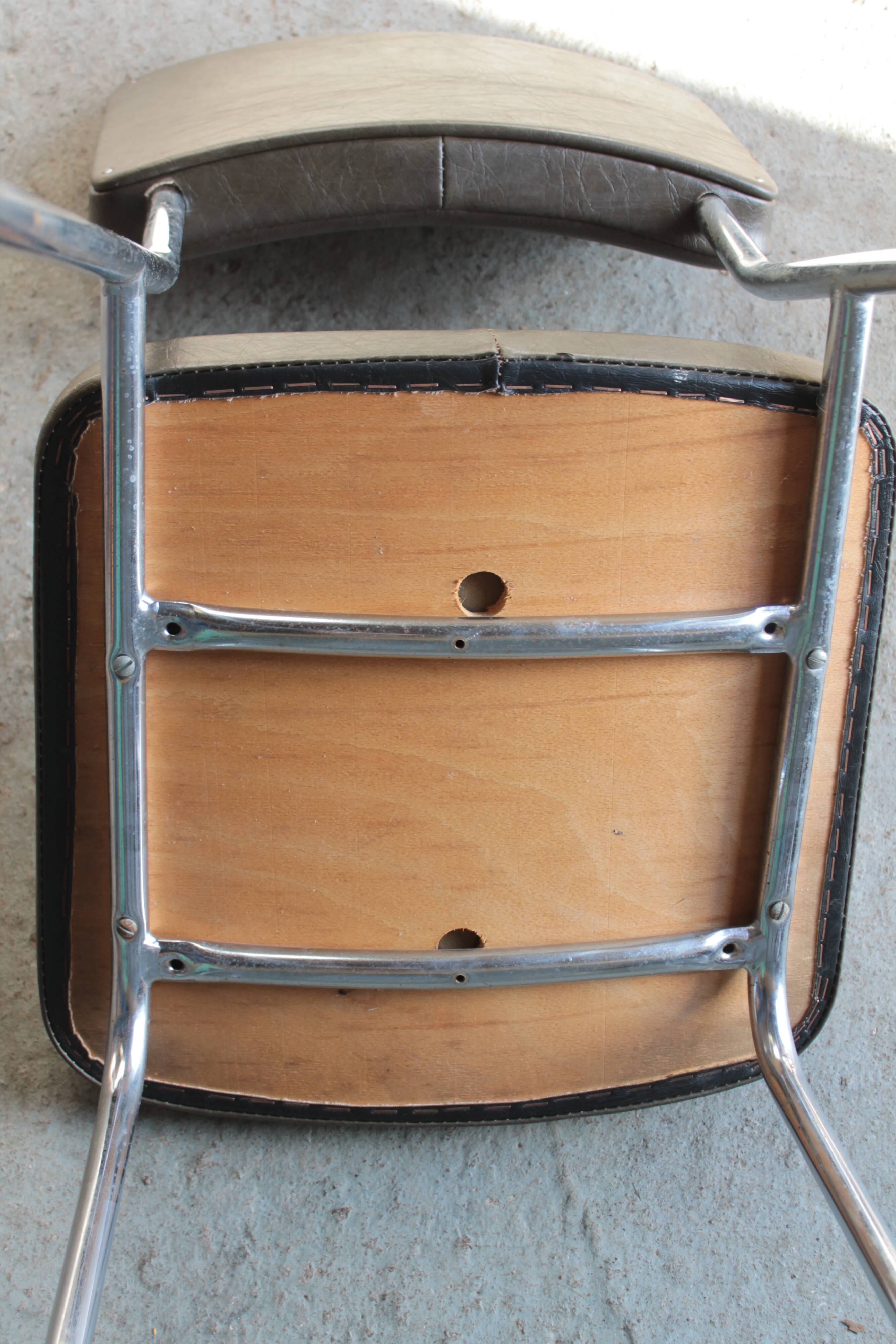 3 bronze-green faux leather chairs with chrome frames