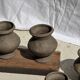 Small brutalist handcrafted terracotta vase with a pedestal, Indonesian, H19 D17.