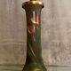 Pied de lampe en verre teinté à décor végétal émaillé