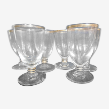 Set of 6 glasses with golden digestive liquor