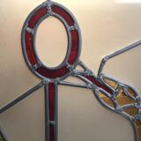 Old stained glass sign with deciduous decoration and microscope