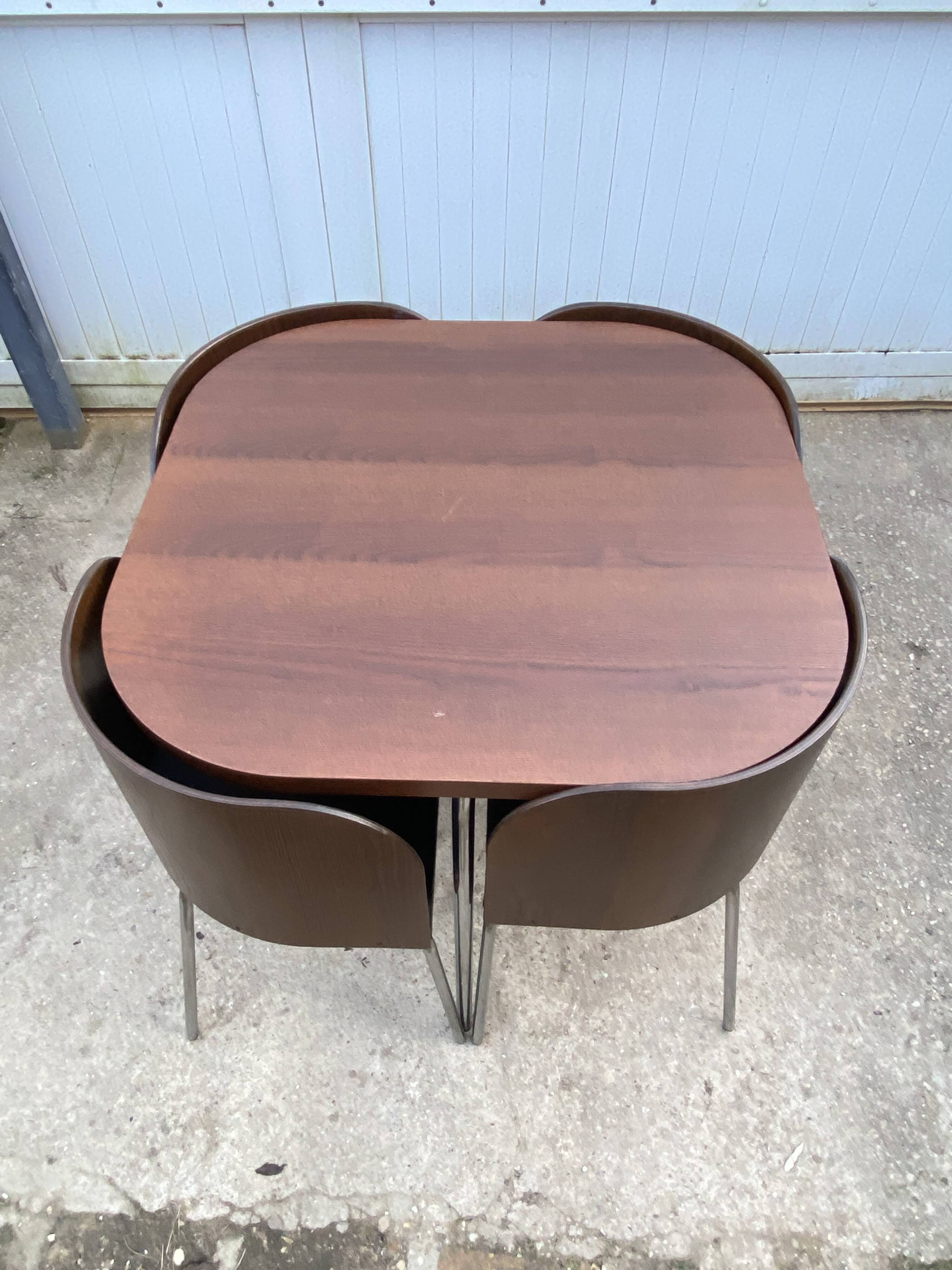 Fusion table and 4 teak chairs by Sandra Kragnert IKEA.
