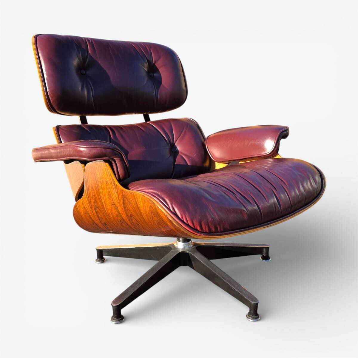 Original Eames lounge chair by Herman Miller in burgundy rosewood.