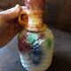 Bottle and its 4 slip cups