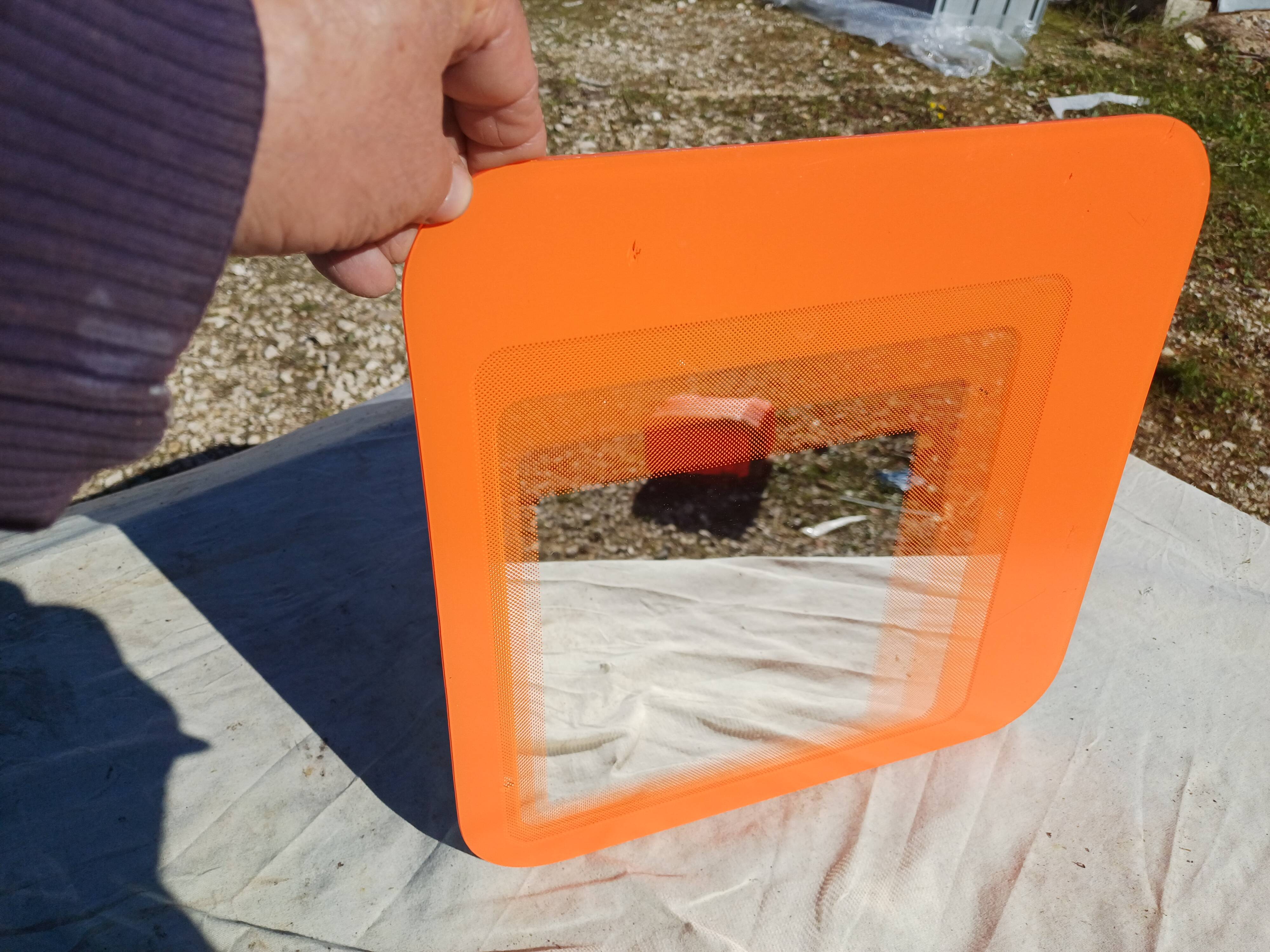 Vintage orange glass mirror
