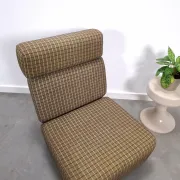 Vintage pull-out sofa bed, brown checked lounge chair with chrome.