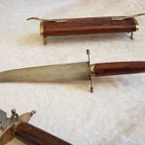 Vintage cutting service with knife and fork in wooden sheath