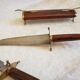 Vintage cutting service with knife and fork in wooden sheath
