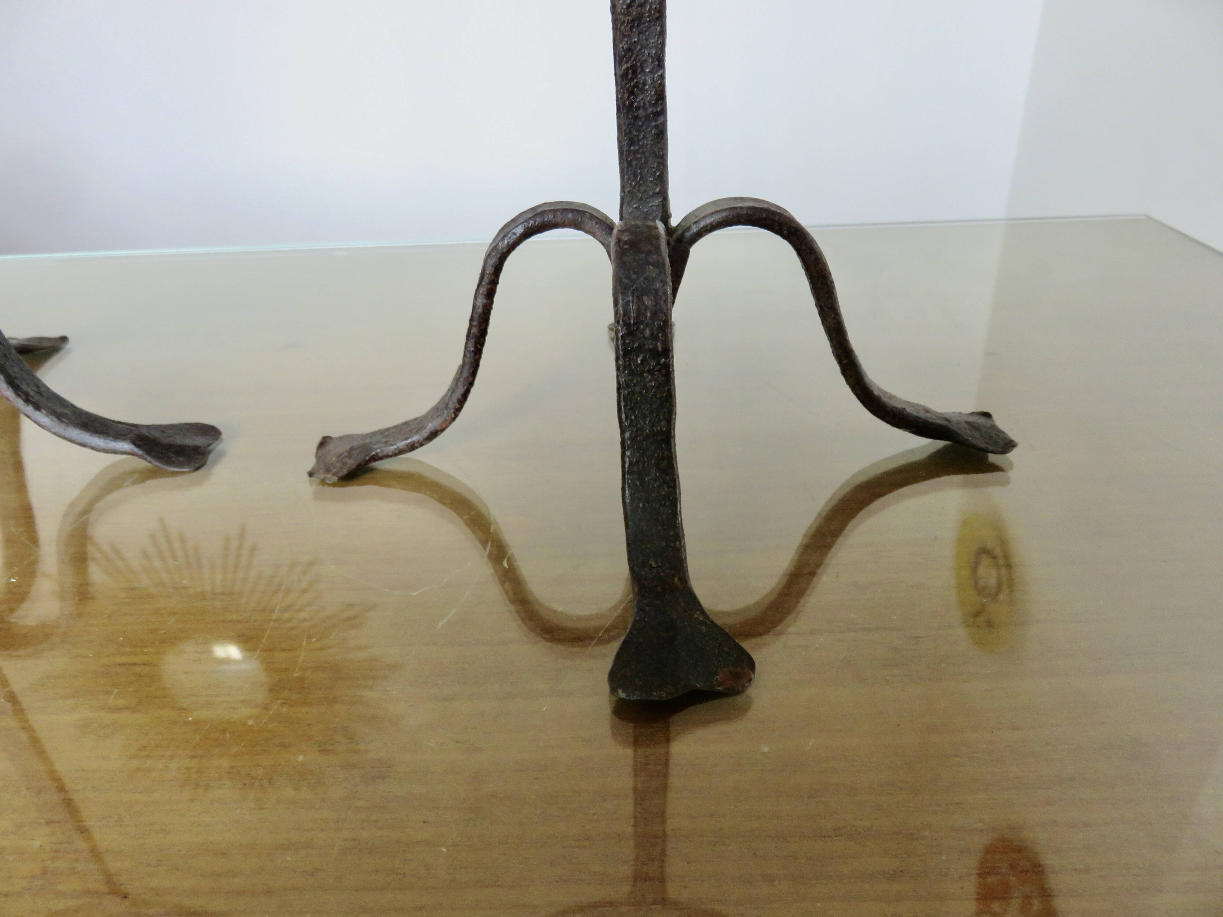 Pair of antique wrought iron candlesticks