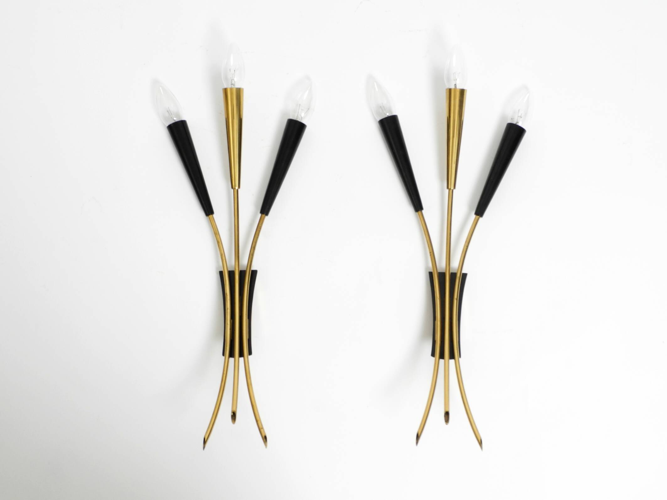 Two beautiful large Mid Century Modern brass 3-light cone wall lamps