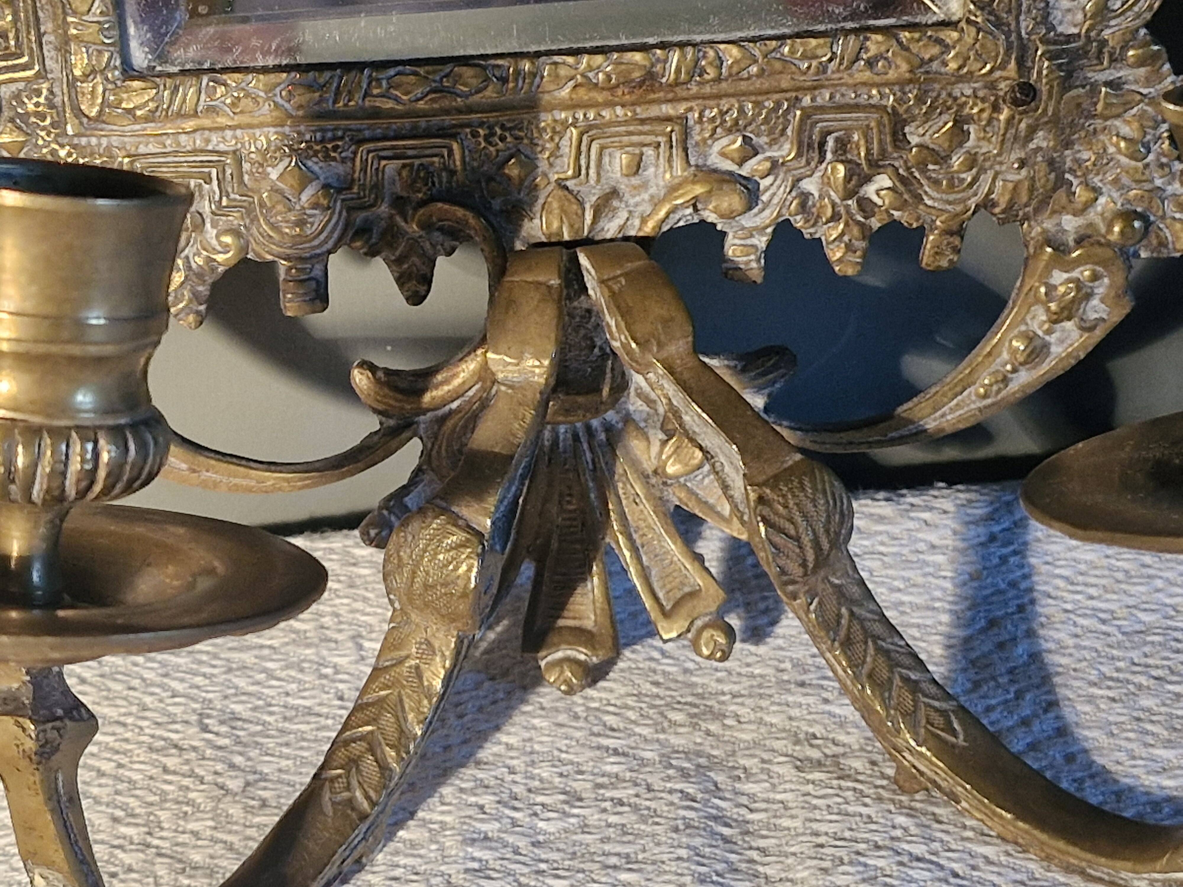 Pair of mirror sconces/candle holders in 19th-century bronze.