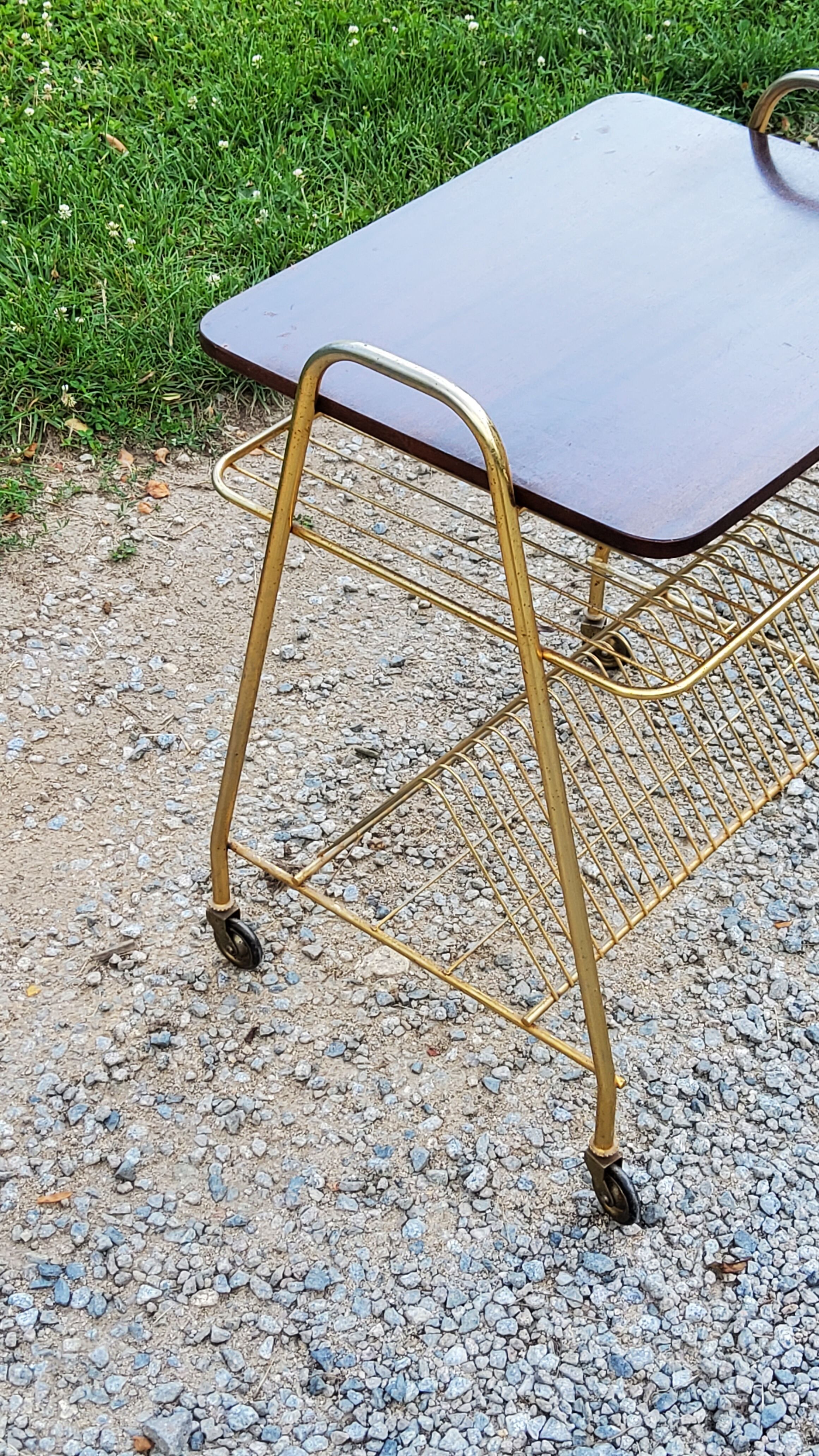 Side table of the 60s mahogany and gold metal range discs