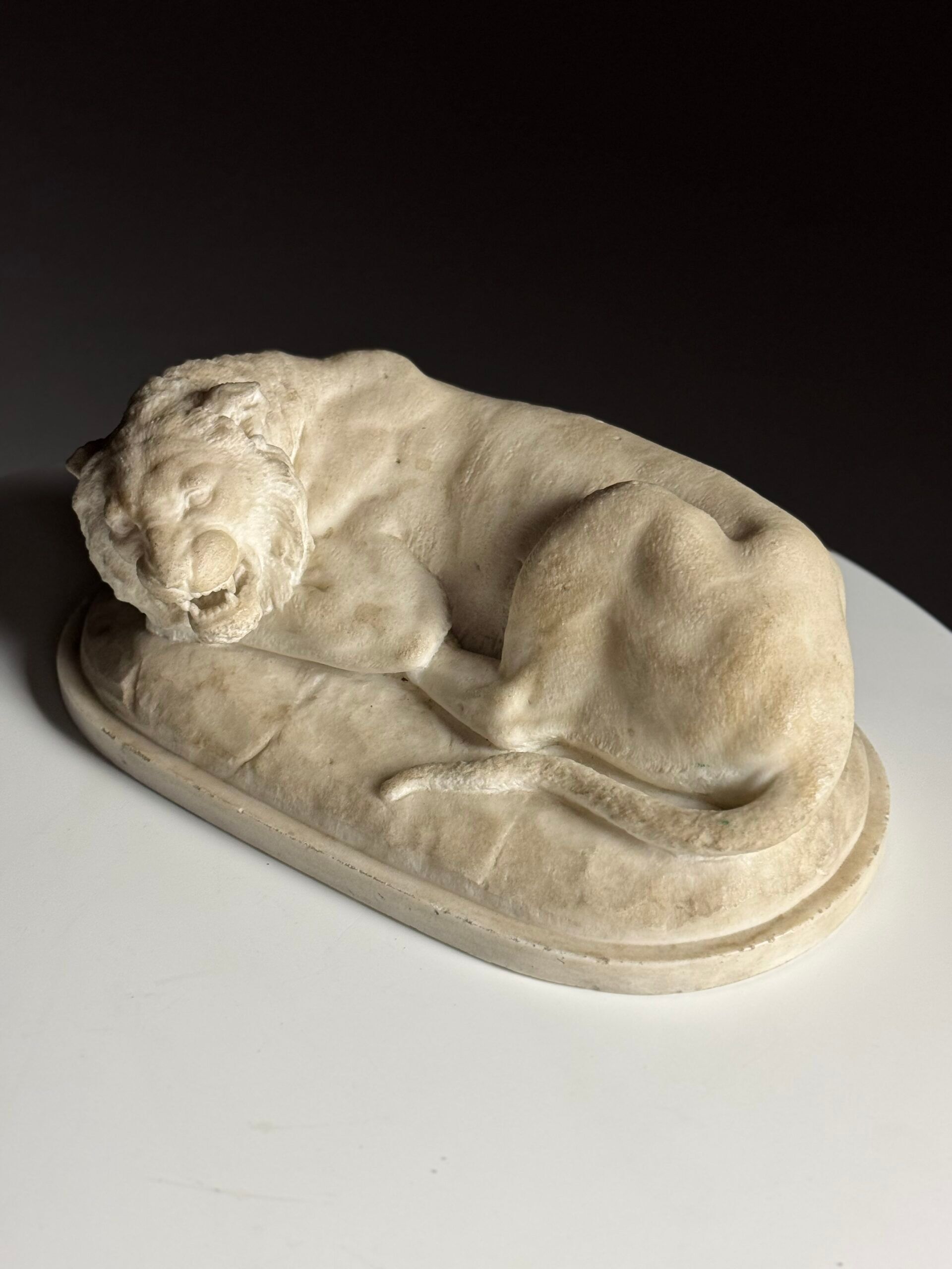 Marble sculpture of a reclining lion