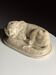 Marble sculpture of a reclining lion