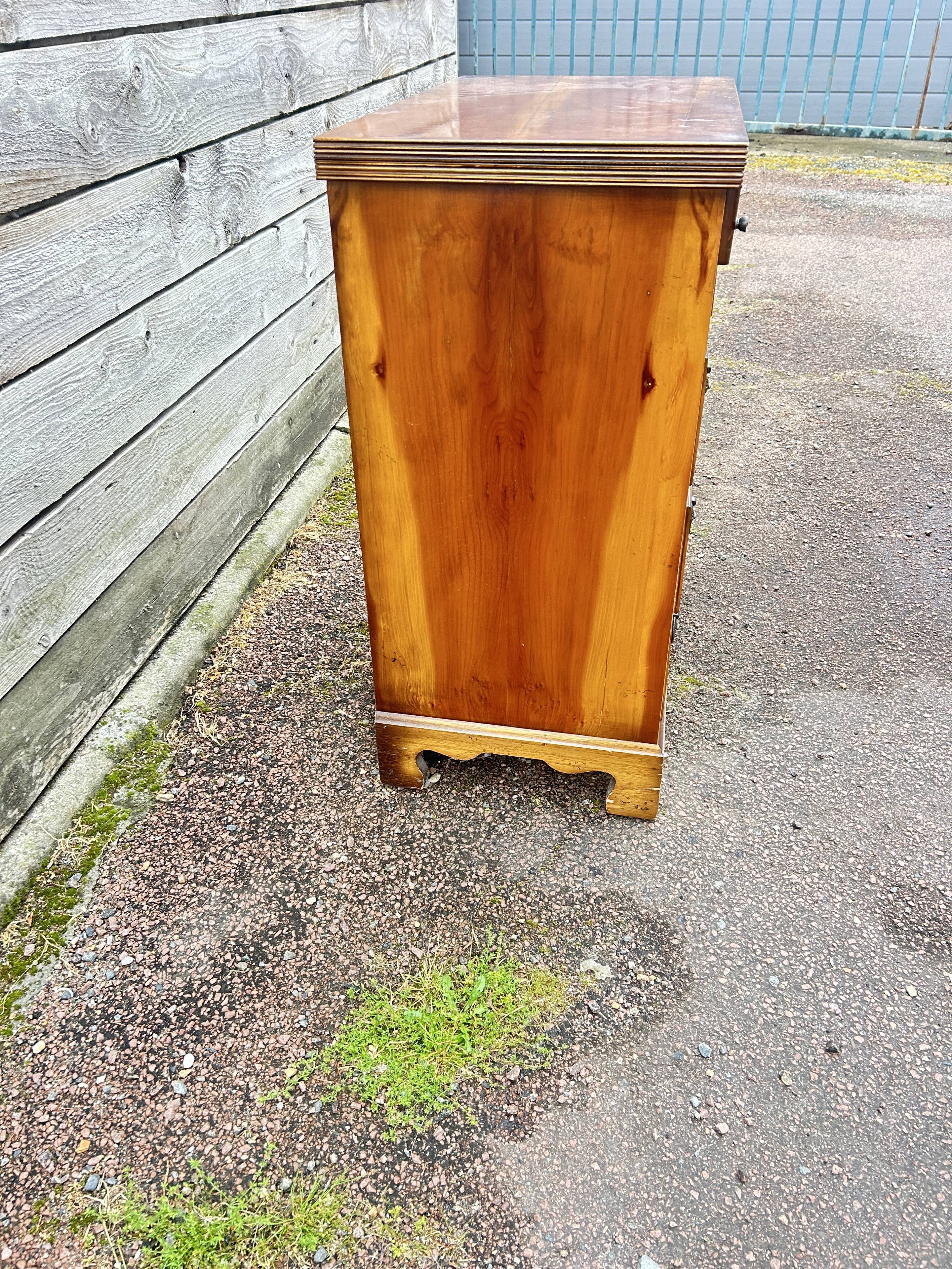 Small English chest of drawers with a folding top.