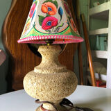 Sandstone foot accent lamp surmounted by a painted lampshade