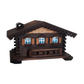 Wooden chalet cigarette display